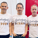 Dominic Monaghan, Elijah Wood, and Billy Boyd pose in shirts that read “You Are All Welcome Here.”